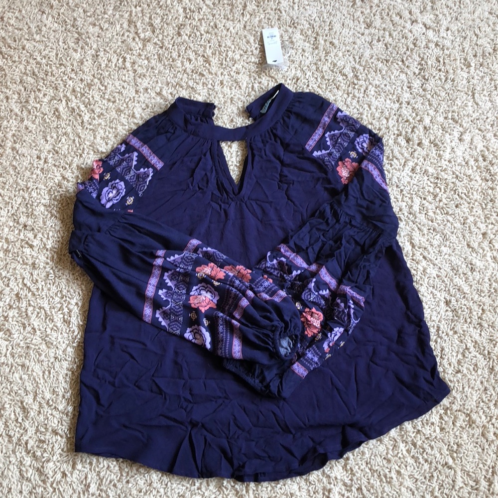 Never worn long sleeve Francesca’s shirt.